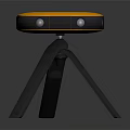 Sleek Orange And Gray Electronic Device With Circular Top And Tripod Stand Design