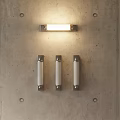 Modern Rectangular and Cylindrical Wall Lights Mounted on Concrete Wall with Illuminated Glow
