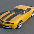 Yellow Chevrolet Camaro Sports Car With Sleek Design On Road Surface