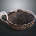Ancient Carved Clay Bowl With Intricate Patterns And Decorative Handle