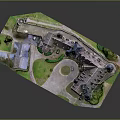 Medieval Stone Castle Architecture With Multiple Towers Spires Courtyard And Green Areas