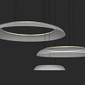 Multiple Modern Circular Pendant Lights With Illuminated LED Rings And Contemporary Design