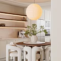 Modern Dining Living Room Interior Design With White Geometric Chandelier Green Artwork And Tea Set