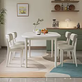 White Round Dining Table and Chairs Set with Decorative Plants Fruits in Modern Kitchen Space
