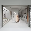 AMAXH Modern Clothing Store Interior With White Design Glass Door And Clothes On Hangers