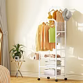 White Rolling Garment Rack With Hanging Clothes And Storage Shelves In Bedroom