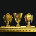 Golden Decorative Ornament Set With Harp Shaped Centerpiece Spiral Tassel Side Pieces On Wavy Base
