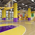 Vibrant Basketball Gym With Yellow Purple Pillars Court Floor White Lines Hoops And Wall Murals