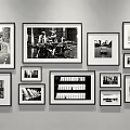 Black and White Photo Wall with Various Sizes Frames and Street Scenes