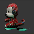 Red Monkey Plush Toy With Colorful Pattern And White Face On Green Mat