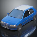 Blue Small Hatchback Car With White Roof And Black Windows On Reflective Surface