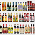 Assorted Condiment Bottles Including Sauces Oils And Vinegars For Kitchen Cooking Essentials