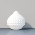 White Textured Ceramic Vase On Grey Tabletop With Light Grey Wall Background 3d model