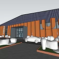 Large Industrial Plant Red Brick Facade Entrance Pedestrians Green Plants Birds in Sky