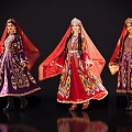 Three Ethnic Women In Traditional Colorful Costumes With Ornate Embroidery And Headscarves