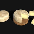 Whole Round Artisanal Cheese with Sliced Pieces on Wooden Board