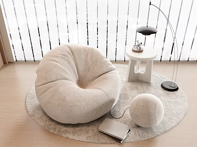 Cozy Bean Bag Chair on Round Rug with Small Side Table Floor Lamp and Laptop 3d model