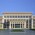Modern Beige Office Building With Symmetrical Design Large Windows Front Entrance Lawn And Trees