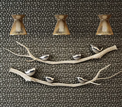 Three Gold Chandeliers Hanging On Textured Dark Wall With Silver Bird Decorations On Branches 3d model