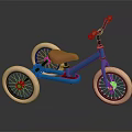 Blue Kids Tricycle With Brown Seat Orange Handlebars And Three Wheels On Black Reflective Surface