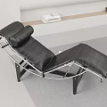 Black Leather Lounge Chair with Modern Curved Metal Frame and Comfortable Design