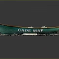 Green and White Cape Bay Model Boat Placed on Rock Base