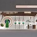 Elegant Luxury Hermes Shop Window Display With Green Dress And Green Items On Display Stands