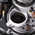 Stainless Steel Coffee Machine With Coffee Beans And White Cups In Kitchen