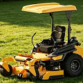 Yellow Riding Lawn Mower Function Vehicle With Sunshade Seat On Green Grass