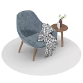 Comfortable Blue Lounge Chair With Checkered Blanket And Side Table With Green Plant