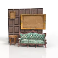 Vintage Green Floral Sofa With Small Round Table Against Dark Paneled Wall and Picture Frames