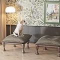 Upholstered Ottomans With Wooden Legs In Living Room With Dog Floral Wallpaper And Floor Lamp