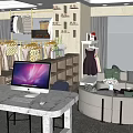 Modern Clothing Store Interior With Display Racks Computers And Sofa Seating Area