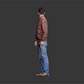 Man Wearing Red Jacket and Blue Jeans Standing Against Gray Background