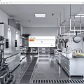 Commercial Kitchen With Stainless Steel Appliances Hanging Pots Worktables And Bright Lighting