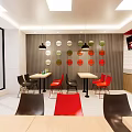 Modern Restaurant Interior With Red Black Chairs Tables Circular Colorful Wall Decor And Pendant Lights