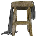 Natural Wooden Stool With Gray Fringed Blanket Draped Over Rustic Structure