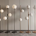 Modern Minimalist Floor Lamps With White Spherical Shades Black Gold Poles And Circular Bases