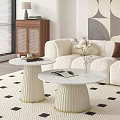 Stylish White Coffee Tables with Pleated Base Gold Trim and Magazines on Patterned Rug Featuring Flower Vase