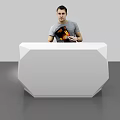 White Geometric Reception Desk With Man Standing Behind Holding Book