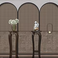 Wooden Plant Stands with Carved Design Holding Flower Vase and Decorative Statue Near Green Plant
