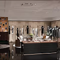 Modern Clothing Store Interior With Clothes On Wooden Racks Display Counter Sofa And Lighting