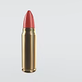 Detailed Golden Bullet With Red Tip Isolated On Light Background