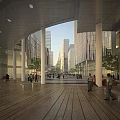 Modern Office Building With Plaza Area Pedestrians Green Trees And Tall Buildings