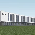 Modern Industrial Factory Building Featuring White Exterior Large Glass Windows Green Grass And Trees