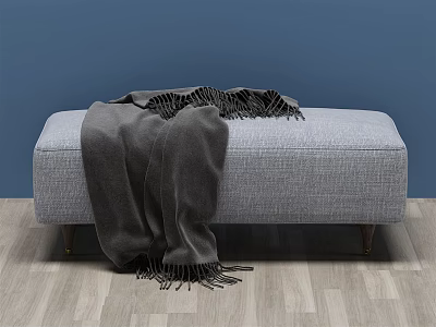 Gray Fabric Ottoman With Dark Gray Blanket On Wooden Floor And Blue Wall 3d model
