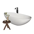 Modern Minimalist Oval Freestanding Bathtub With Wooden Side Table Potted Plant And Scented Candle