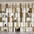 Modern Open Grid Bookshelf With Books Decorative Sculptures And Vases In Bright Room
