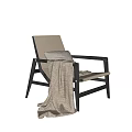 Modern Leisure Chair With Dark Wooden Frame Light Cushion Gray Pillow And Woven Blanket