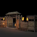Ancient Wooden Gate Structure With Watchtowers Lit Torches And Palisade Fence